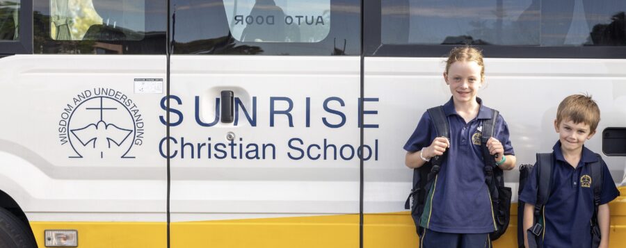 Two students about to board the bus