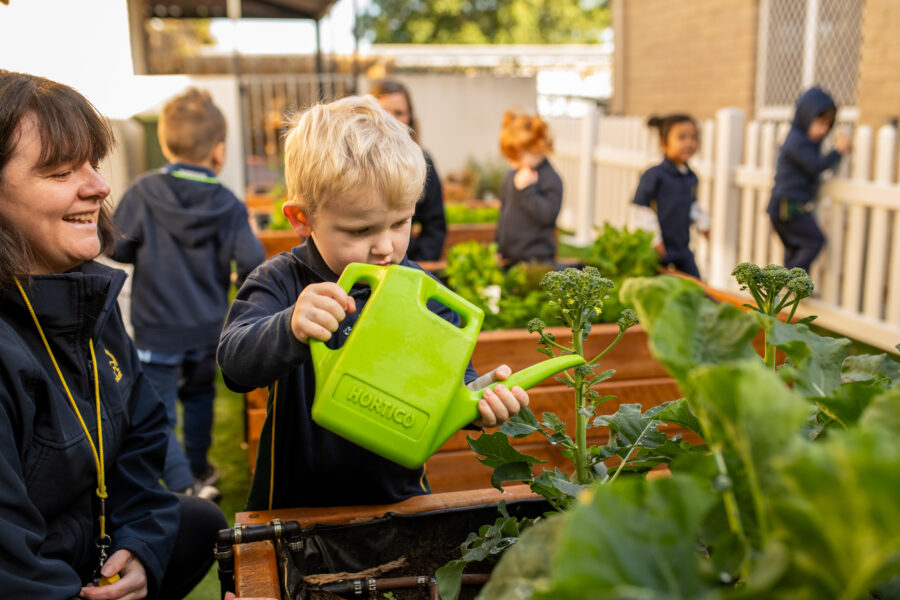 Students watering garden