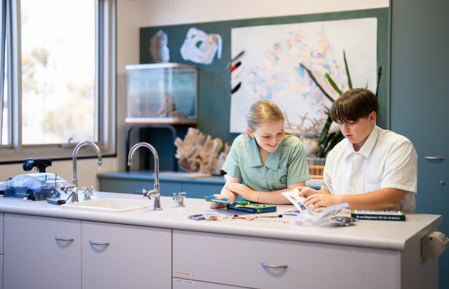 Students in a classroom doing a STEM activity.