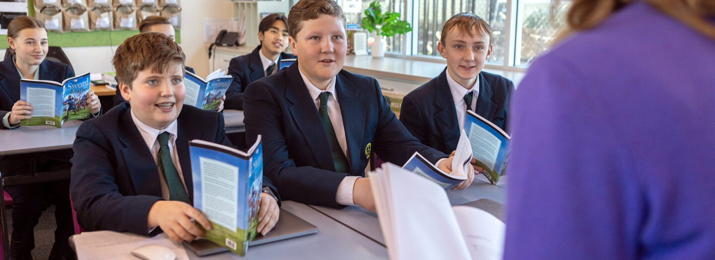 Students in a classroom reading.