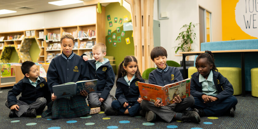 Buddies reading together in the library